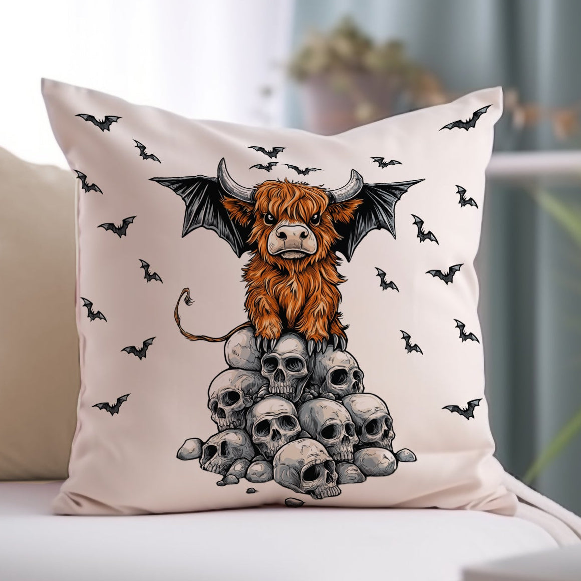 Decorative pillow with a cow and bats design on a couch